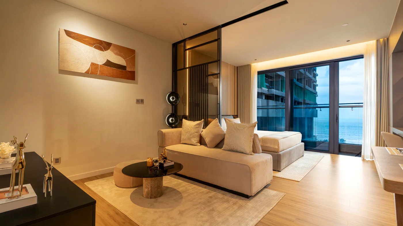 Light-filled living room with floor-to-ceiling windows at Maison D’Rose Đà Nẵng